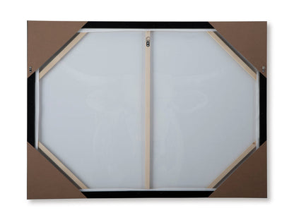 Back of framed wall art with hexagonal backing and hanging brackets.