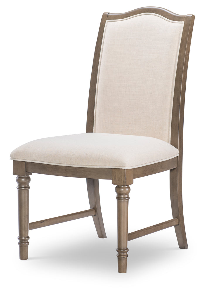 Upholstered dining side chair with light beige seat, tall back, dark wood legs