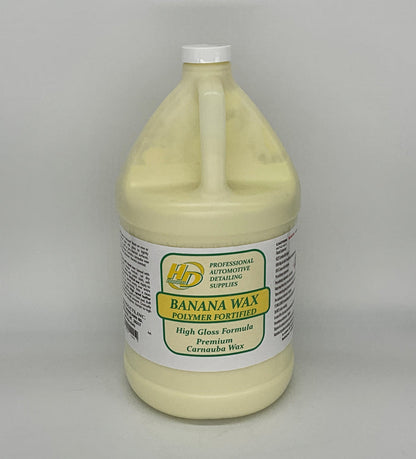 1 Gallon container of banana wax polymer on a gray background