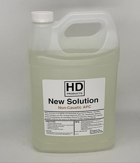1 gallon of HD Products New Solution Non-Caustic APC on a gray background