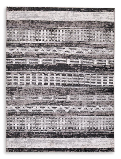 Gray and white geometric striped area rug with horizontal bands and distressed texture