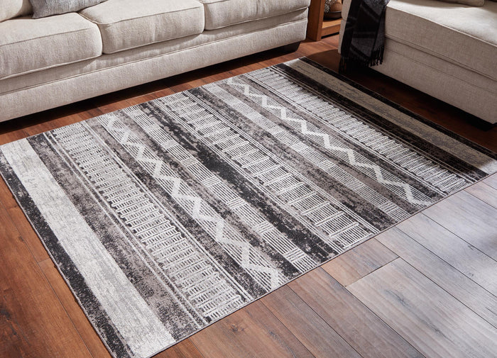 Gray and white geometric area rug with wide stripes and zigzag pattern, flatwoven look