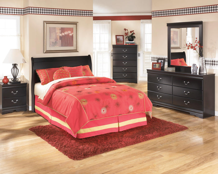 Black sleigh-style headboard with upholstered panel