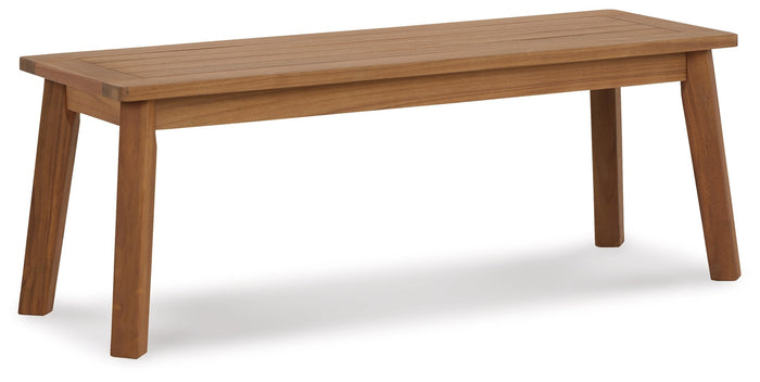 Outdoor dining bench with slatted top and tapered legs, light wood finish
