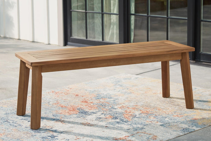Wood dining bench with horizontal slat seat and tapered legs, light brown
