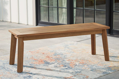 Wood dining bench with horizontal slat seat and tapered legs, light brown