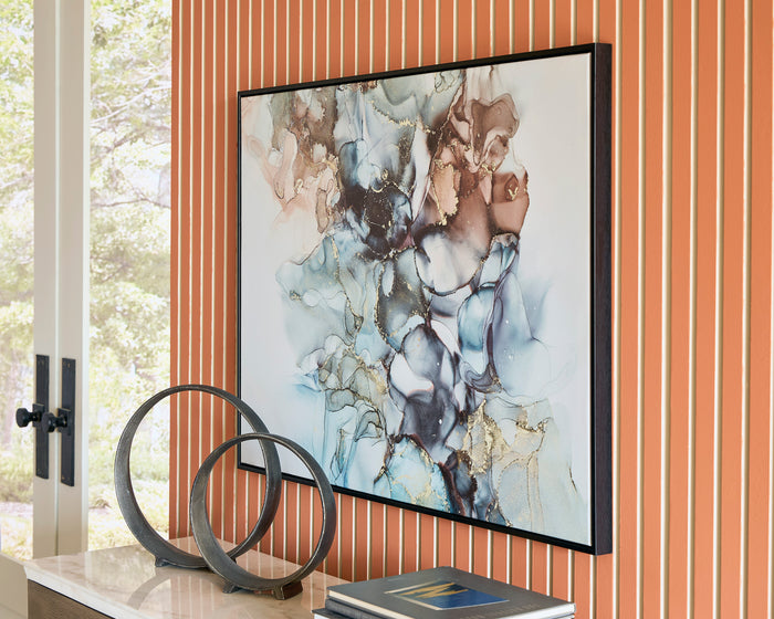 Abstract wall art print in a black frame with blue, tan, and gray fluid textures