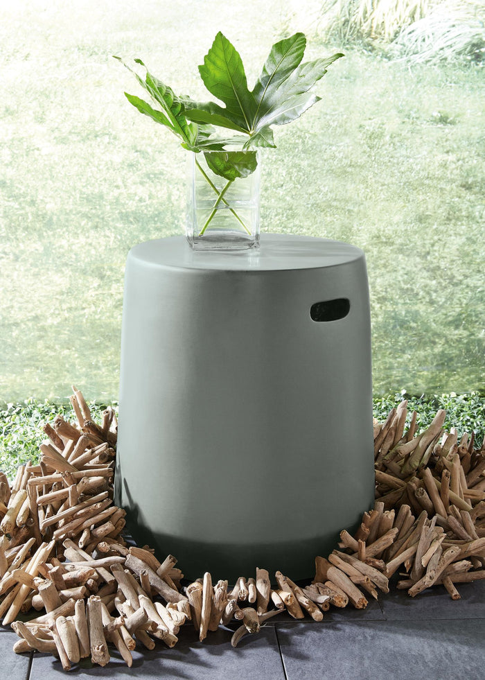 Dark gray cylinder stool with flat top and side slot for carrying