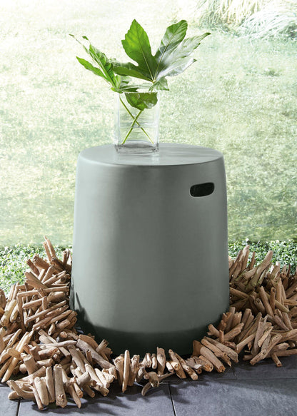 Dark gray cylinder stool with flat top and side slot for carrying