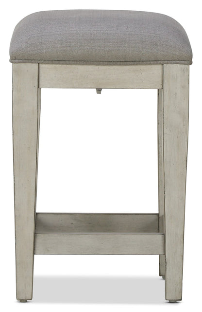 Killian backless stool with gray upholstered seat and light wood frame