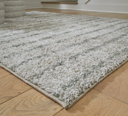 5x7 area rug corner close-up, gray-and-ivory high-pile texture