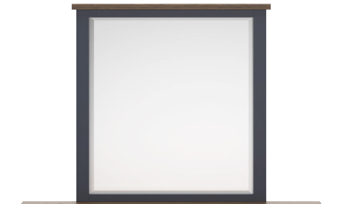 Wall-mounted bedroom mirror with charcoal frame and light wood top trim