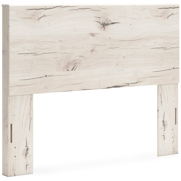 Whitewashed light-wood panel headboard close-up with long vertical openings on legs