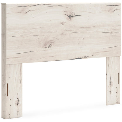 Whitewashed light-wood panel headboard close-up with long vertical openings on legs
