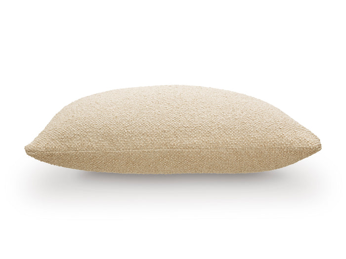 Light tan textured throw pillow, rounded oblong shape