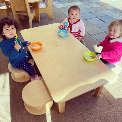 Children sitting on Magda Stools