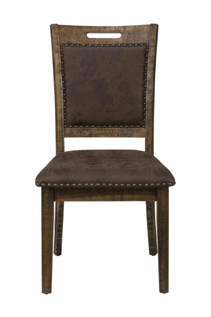 Upholstered dining side chair with dark seat cushion, studded back, wooden legs