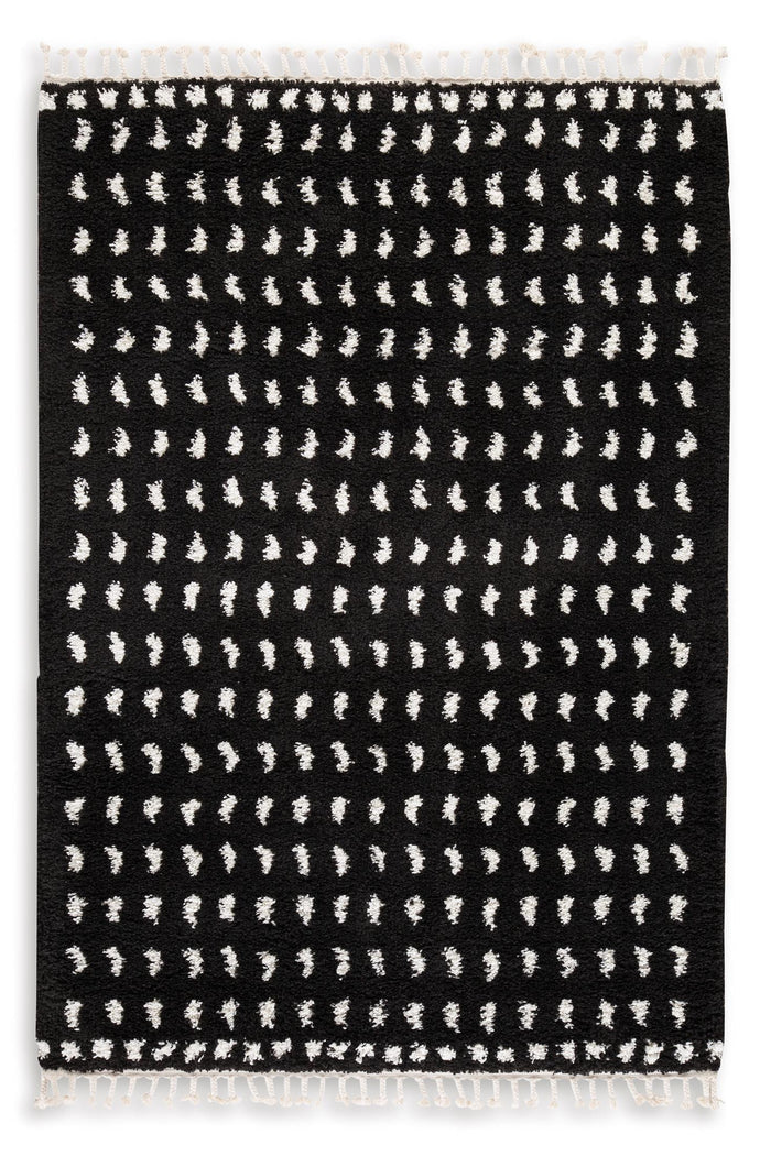 5 x 7 ft black rug with white geometric dash pattern and short fringed edges
