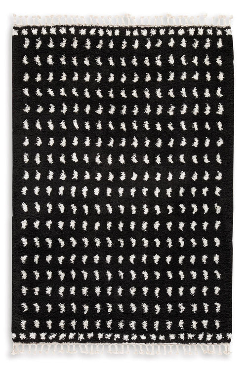 5 x 7 ft black rug with white geometric dash pattern and short fringed edges