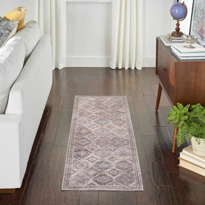 Blue and beige washable 2'2" x 8' rug laid on hardwood floor in living room
