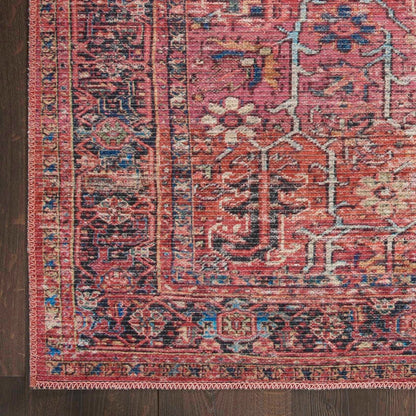 Nc1 washable area rug close-up, red field with blue and cream geometric medallion