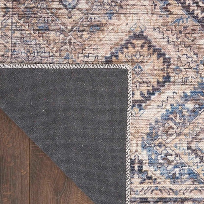 Corner close-up showing rug edge binding and dark underside layer