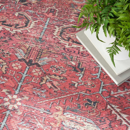 Nc1 washable area rug corner, red and cream pattern with blue accents
