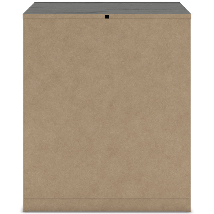 Nightstand back panel in tan fiberboard with small black fastener at top