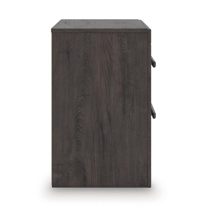Dark wood nightstand side view with two drawer handles