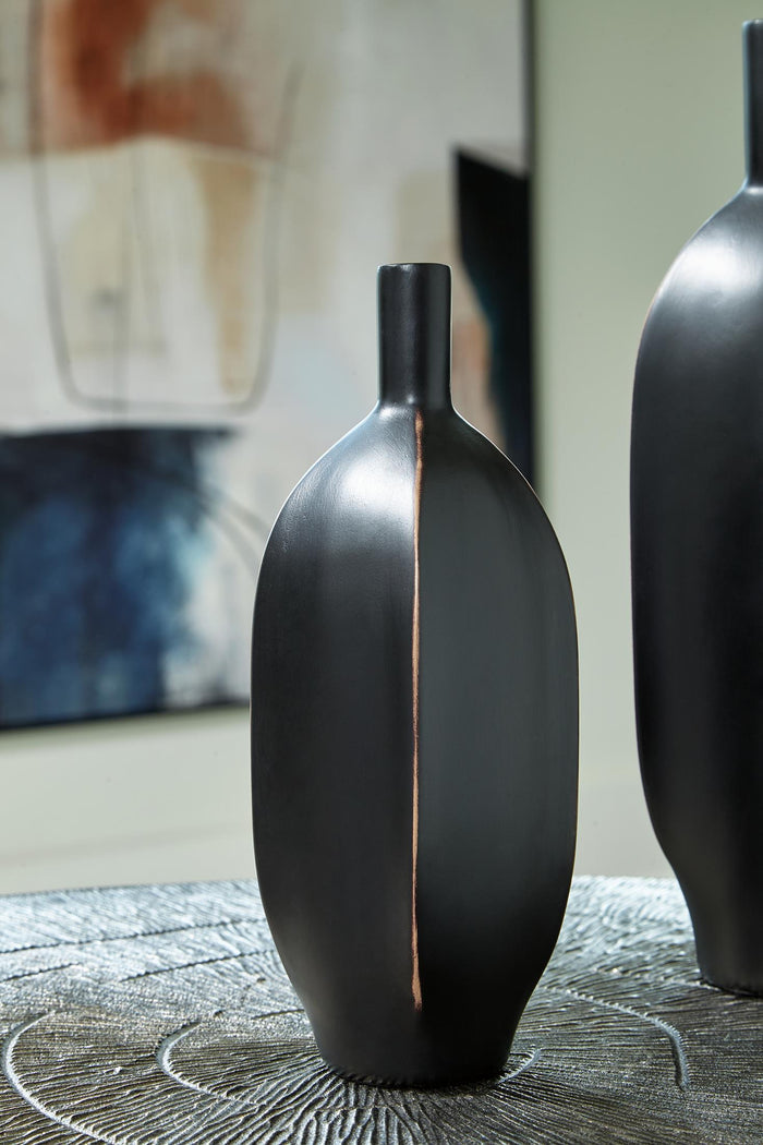 9-inch black vase with narrow neck, rounded body, and copper-toned vertical seam