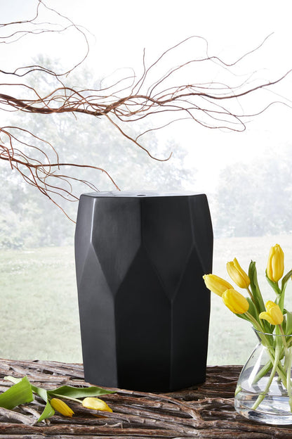 Black geometric faceted stool with flat top, square base
