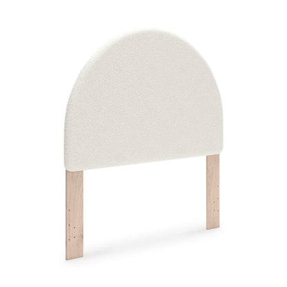 Upholstered headboard with rounded top, light beige upholstery and wooden legs