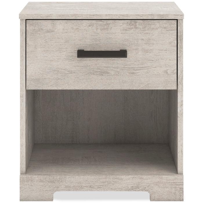 Whitewash nightstand with dark bar drawer pull and open lower shelf.
