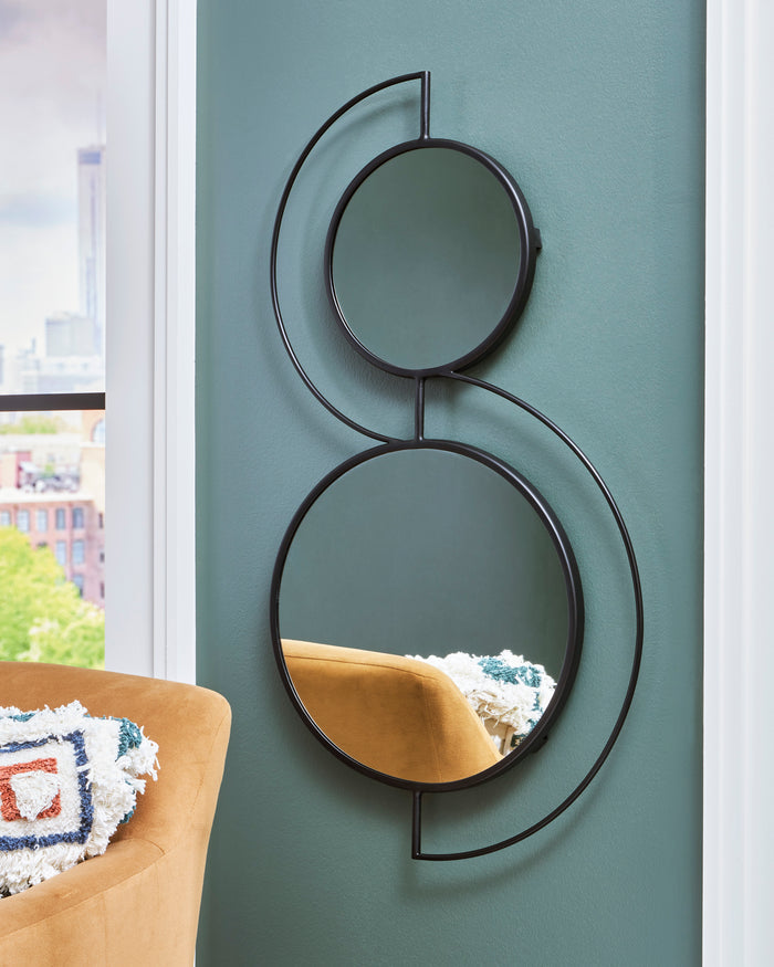 Decorative accent mirror with two overlapping circles and dark metal frames