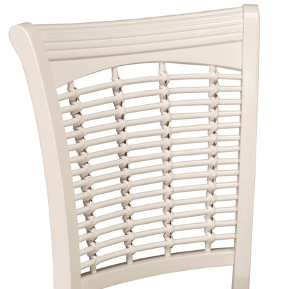 Close-up of a dining chair backrest with a cream-colored wooden frame and woven cane seat slats, shown against a plain white background.