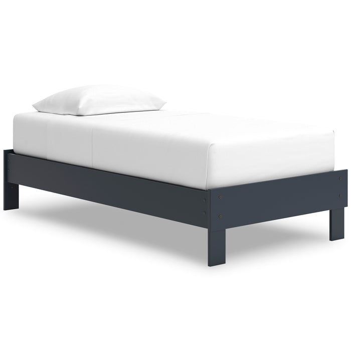 White upholstered platform bed with dark blue side rails and tapered corner legs