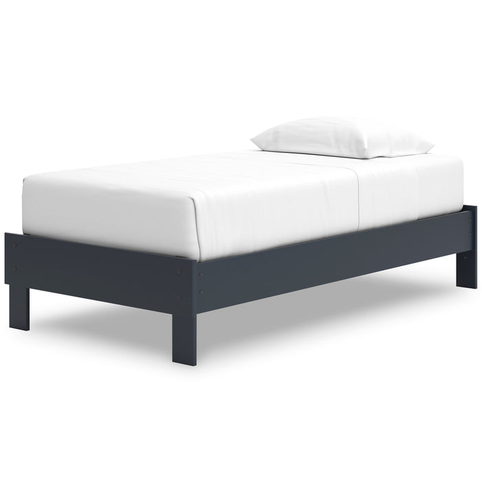 White upholstered platform bed with dark blue frame and low profile