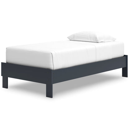 White upholstered platform bed with dark blue frame and low profile
