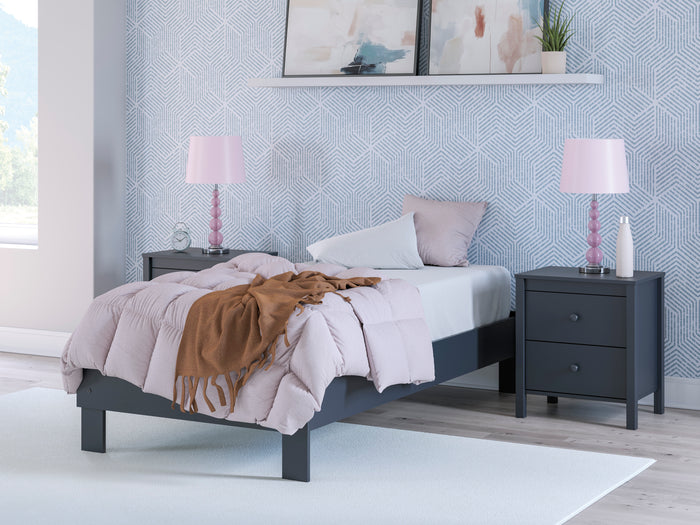 Platform bed with dark blue frame, white upholstered panels, and slatted platform