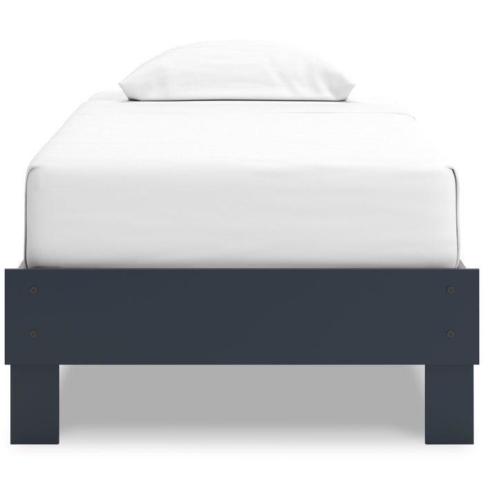 Platform bed with dark blue footboard and legs, showing white mattress