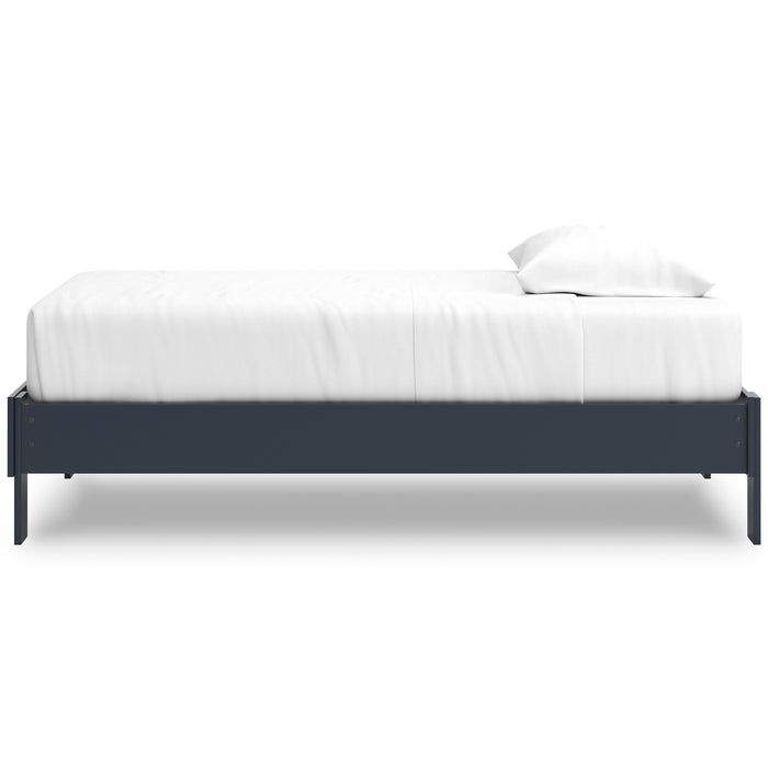 Platform bed with dark blue side frame and white upholstered mattress