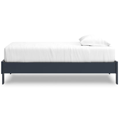 Platform bed with dark blue side frame and white upholstered mattress