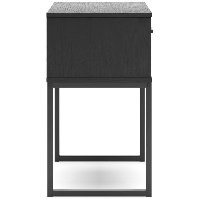 Dark wood nightstand with one drawer and metal bar pull, back view with open base.