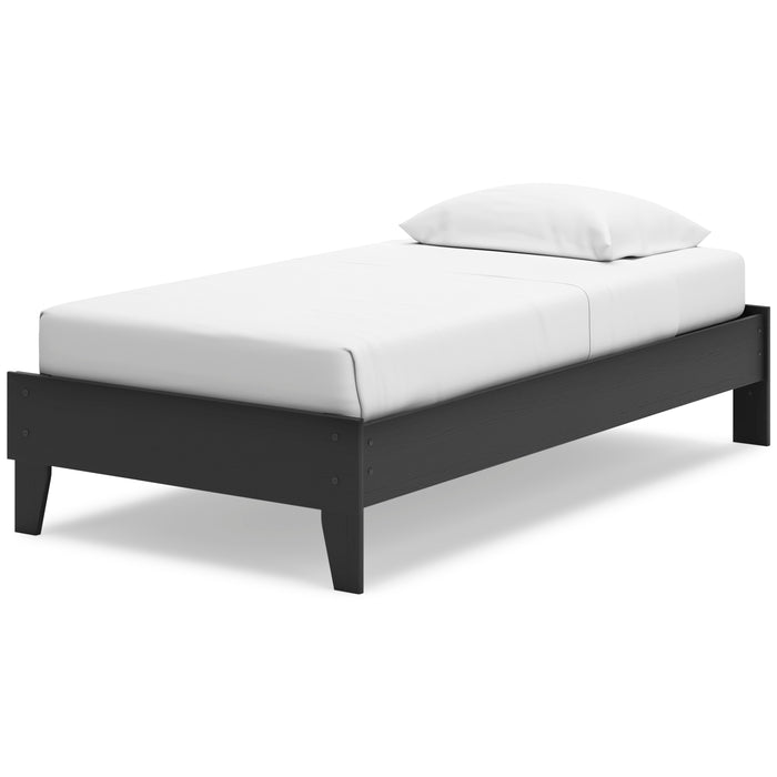 Socalle platform bed with black legs and white upholstered bed base and pillow