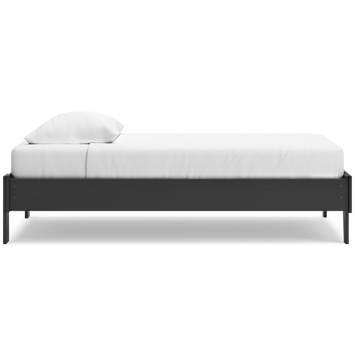 Socalle platform bed side view with dark frame, white mattress, and pillow