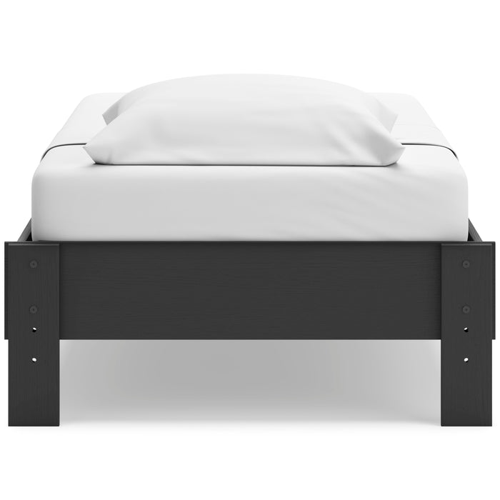 Socalle platform bed with dark headboard and white upholstered mattress and pillow