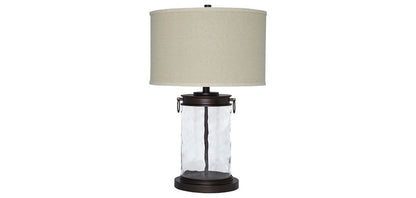 Table lamp with light beige fabric shade and black glass base