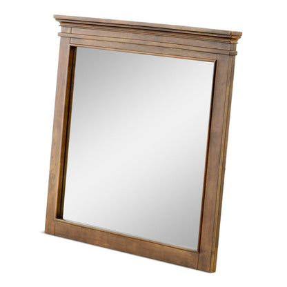 Angled rectangular wood-framed bedroom mirror with brown finish and layered top molding