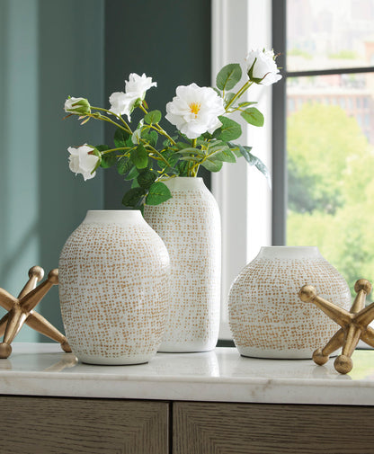Set of 5 speckled ceramic vases with starburst accents and white flowers
