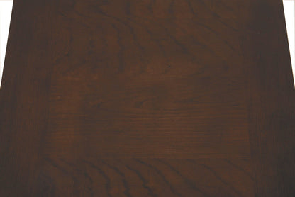 Close-up of dark wood end table tabletop with visible grain pattern.